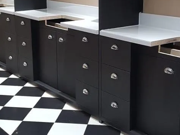 matt black finish with brilliant white work surfaces and chrome cupboard door and draw handles.