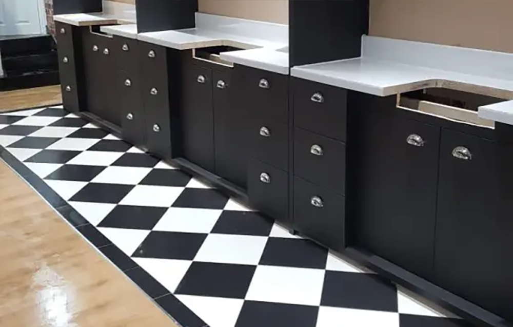 matt black finish with brilliant white work surfaces and chrome cupboard door and draw handles.
