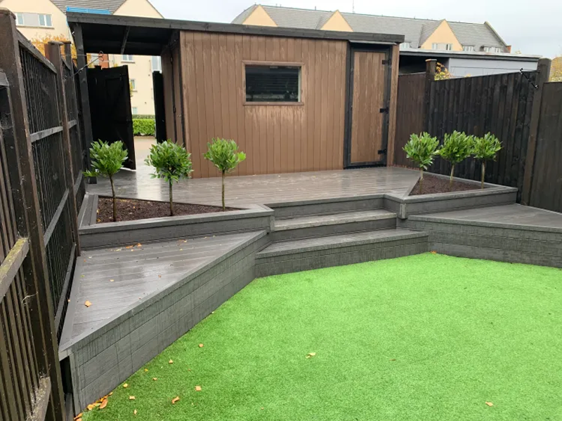 Side view of the garden shed installed on top of raised decking