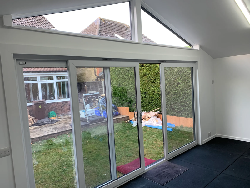 Inside view view of the sliding patio doors and triangular windows