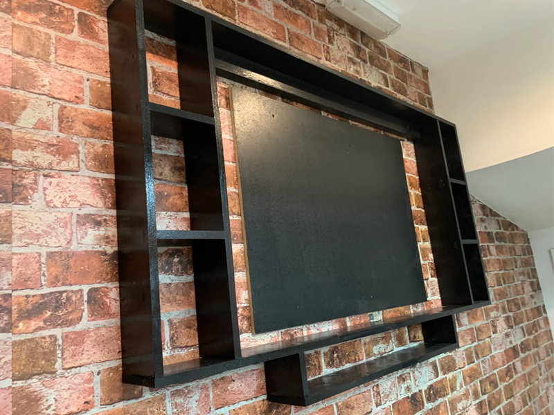 custom, fitted media tv frame finished in matt black paint