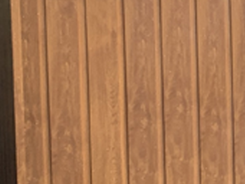 Close up of the Golden Oak UPVC cladding