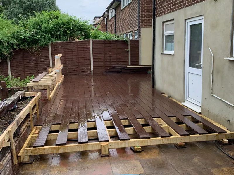 side view property back door, decking treated timber base and composite brown decking boards