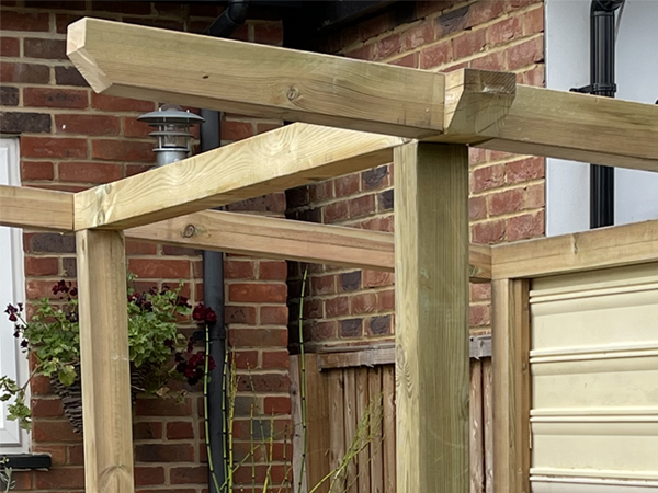 A close up of the treated wood roof structure